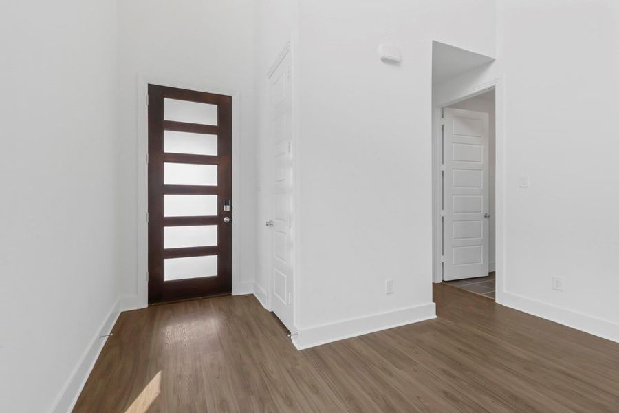 An inviting entryway featuring a beautiful door that sets the tone for the home’s warm and welcoming style. An inviting entryway featuring a beautiful door that sets the tone for the home’s warm and welcoming style.