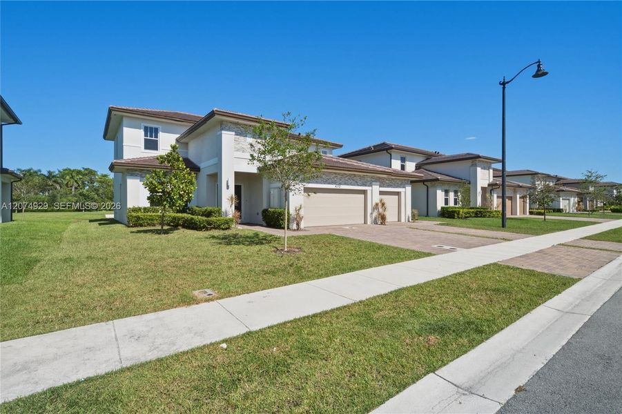 Front exterior of a new home in , Davie, FL, highlighting curb appeal (Image 20). Front exterior of a new home in , Davie, FL, highlighting curb appeal (Image 20).
