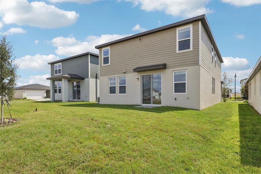 Exterior details and patio area of a home in Crosswinds - Classic Series, Haines City (Image 21).