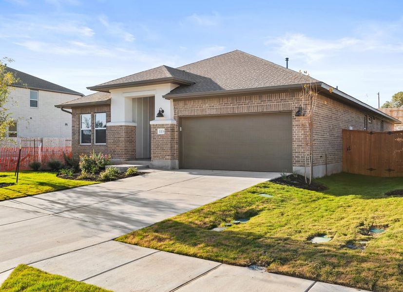 Front exterior of a new home in Park Collection at Lariat, Liberty Hill, TX, highlighting curb appeal (Image 2). Front exterior of a new home in Park Collection at Lariat, Liberty Hill, TX, highlighting curb appeal (Image 2).