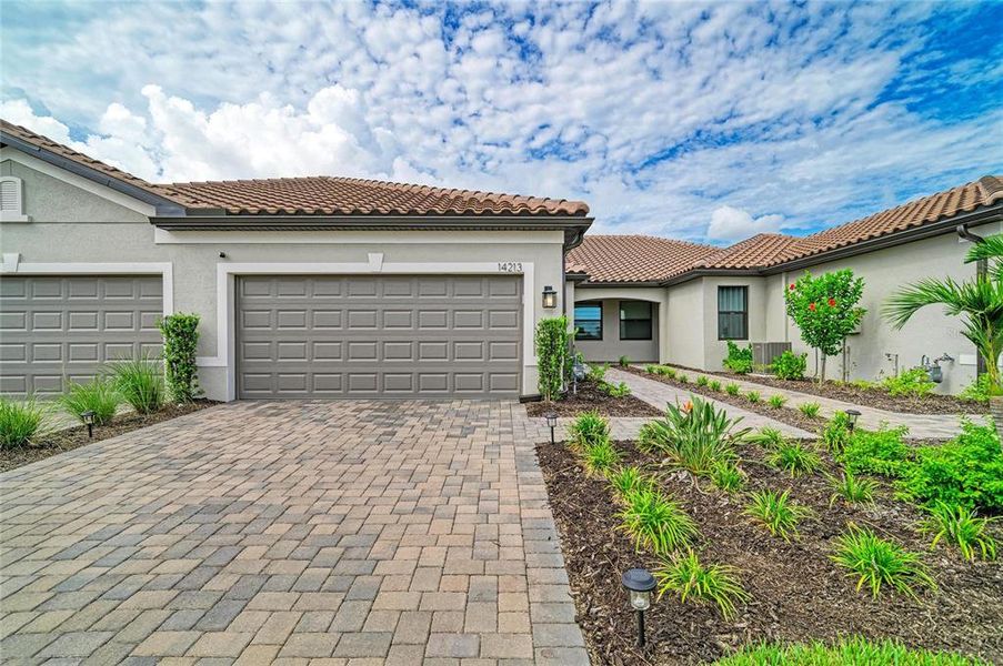Front exterior of a new home in , Nokomis, FL, highlighting curb appeal (Image 24). Front exterior of a new home in , Nokomis, FL, highlighting curb appeal (Image 24).