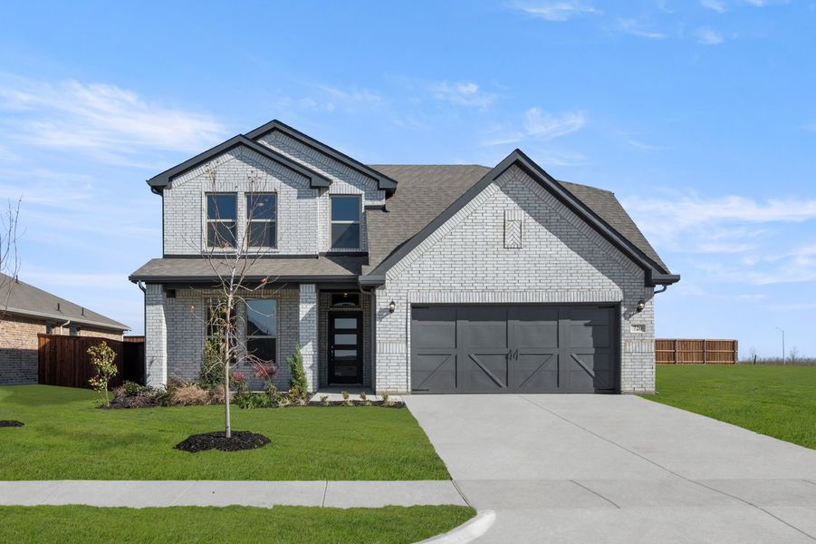 Front exterior of a new home in Myrtle Creek, Waxahachie, TX, highlighting curb appeal (Image 1). Front exterior of a new home in Myrtle Creek, Waxahachie, TX, highlighting curb appeal (Image 1).