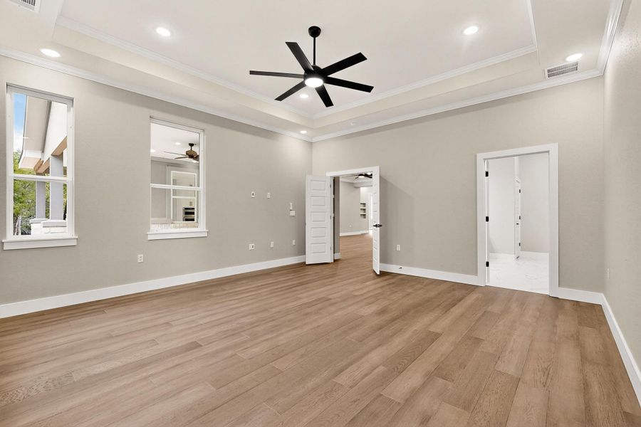 Primary Bedroom with wood flooring, recessed lighting, crown molding, a ceiling fan Primary Bedroom with wood flooring, recessed lighting, crown molding, a ceiling fan