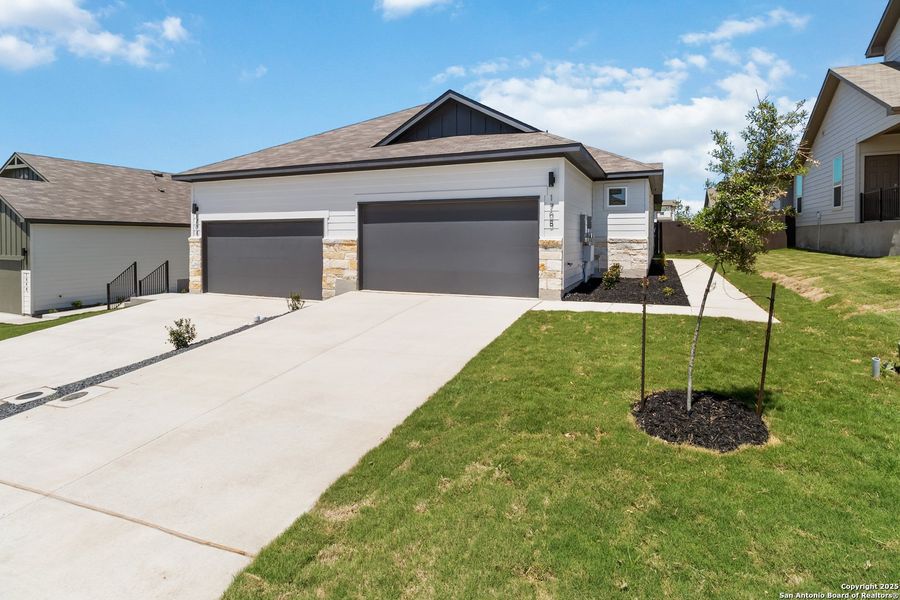 Front exterior of a new home in , San Antonio, TX, highlighting curb appeal (Image 1).
