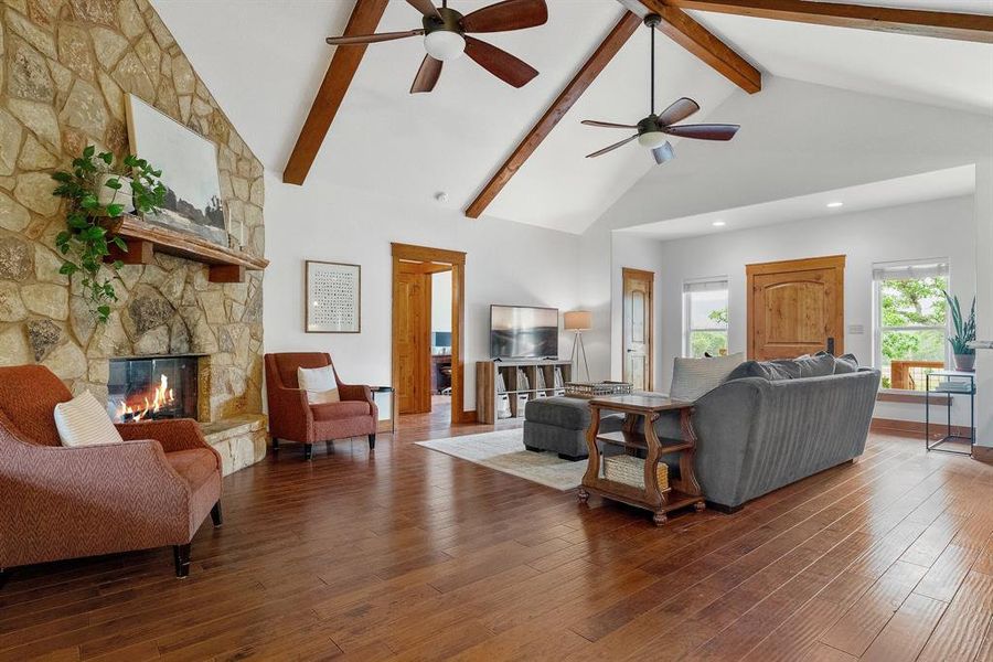 Main living space in home number two offer high ceilings and a cozy fireplace