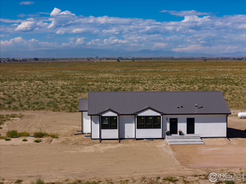 Front exterior of a new home in , Ault, CO, highlighting curb appeal (Image 1). Front exterior of a new home in , Ault, CO, highlighting curb appeal (Image 1).