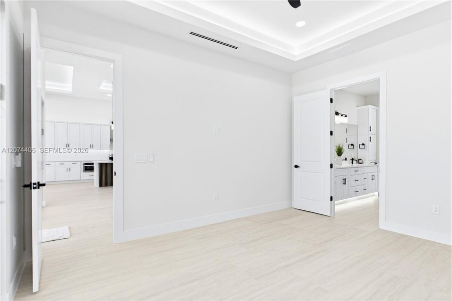 RETREAT to a SERENE PRIMARY SUITE designed for relaxation, w/ a spacious layout, ambient LED-LIT TRAY CEILING & spa-like ensuite. RETREAT to a SERENE PRIMARY SUITE designed for relaxation, w/ a spacious layout, ambient LED-LIT TRAY CEILING & spa-like ensuite.