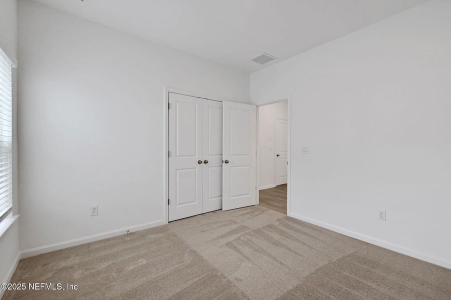 Spacious, unfurnished interior of a new home in TrailMark, St. Augustine (Image 37).