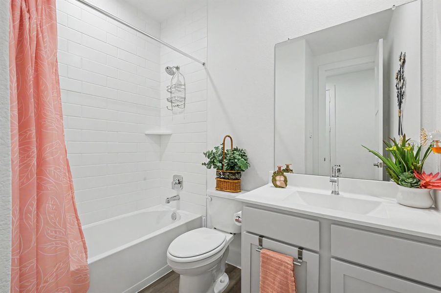 Full bathroom located in the same hallway as secondary bedroom #1 Full bathroom located in the same hallway as secondary bedroom #1