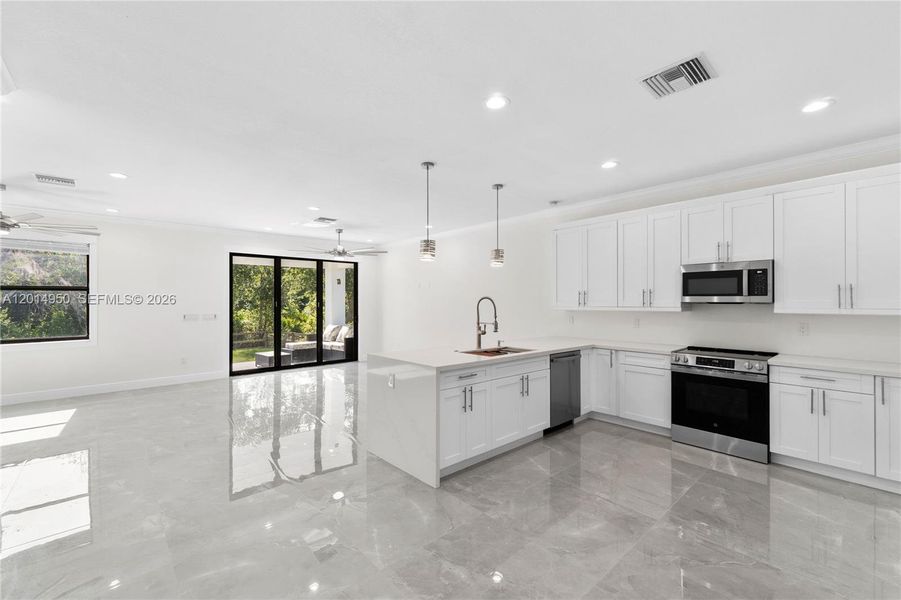 Open concept kitchen and dining area