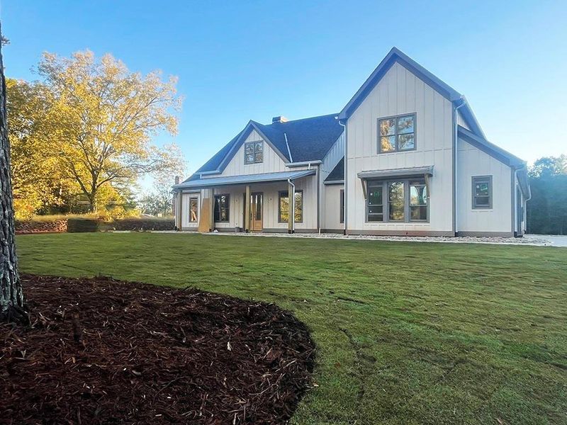 Exterior details and patio area of a home in , White (Image 32).