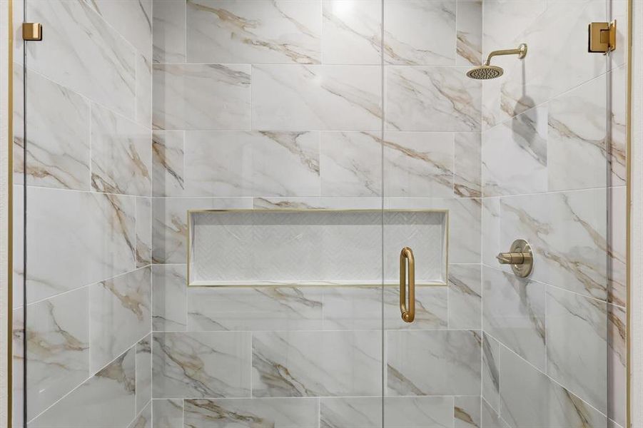 Full bathroom featuring a shower stall