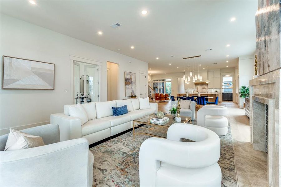 Living room featuring a wealth of natural light and a fireplace