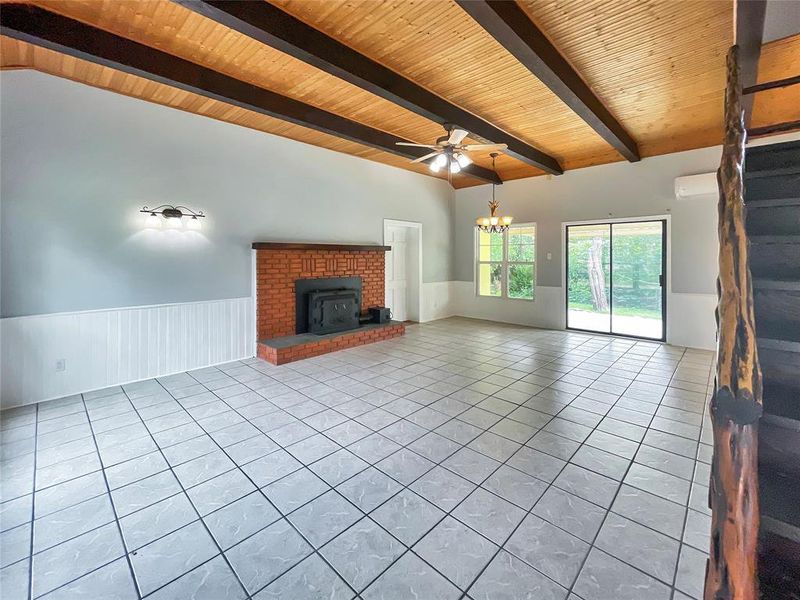 Featuring wood ceiling, beams and woodburning fireplace