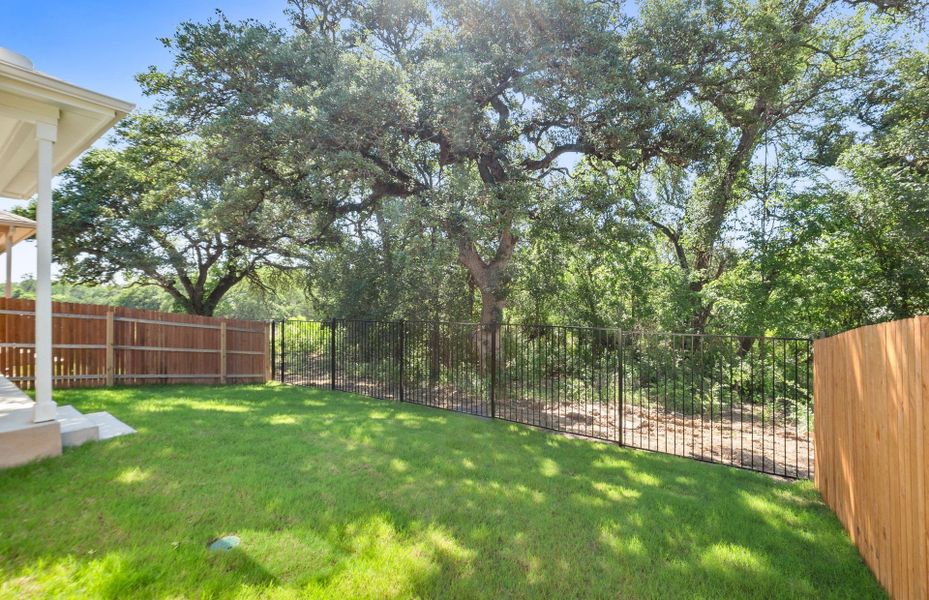Exterior details and patio area of a home in Saddleback at Santa Rita Ranch, Liberty Hill (Image 4).