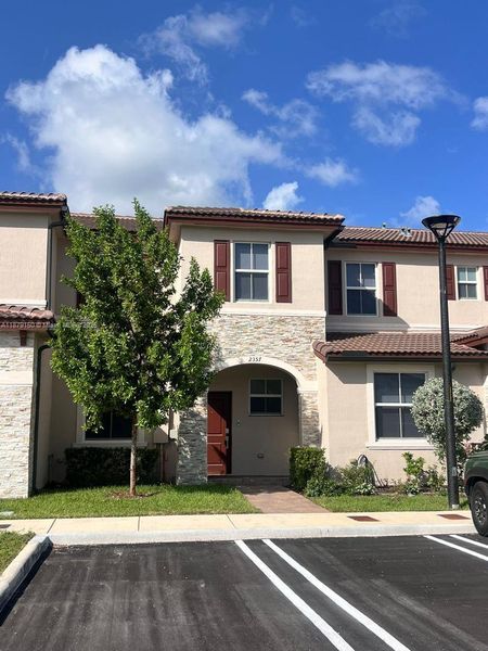 Front exterior of a new home in , Miami, FL, highlighting curb appeal (Image 1).