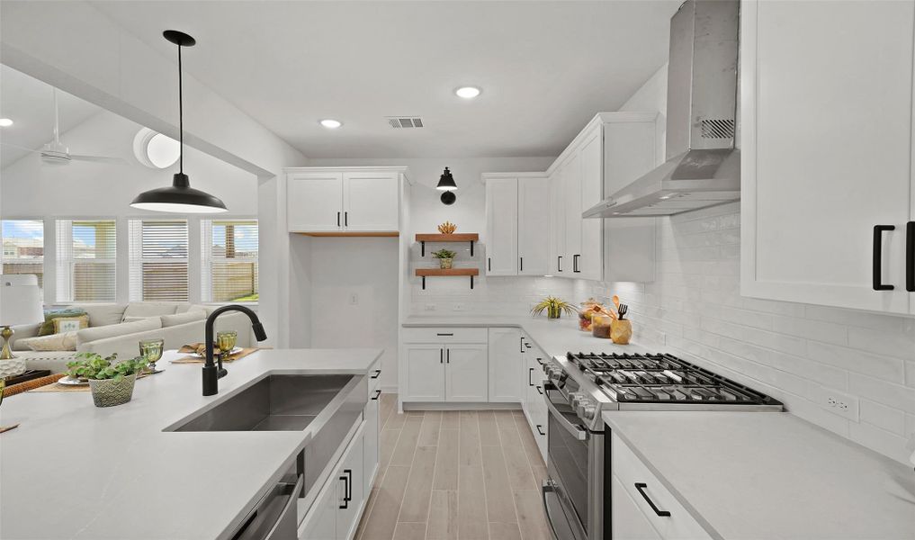 Gourmet kitchen with white cabinets and quartz countertops (*Photo not of actual home and used for illustration purposes only.) Gourmet kitchen with white cabinets and quartz countertops (*Photo not of actual home and used for illustration purposes only.)
