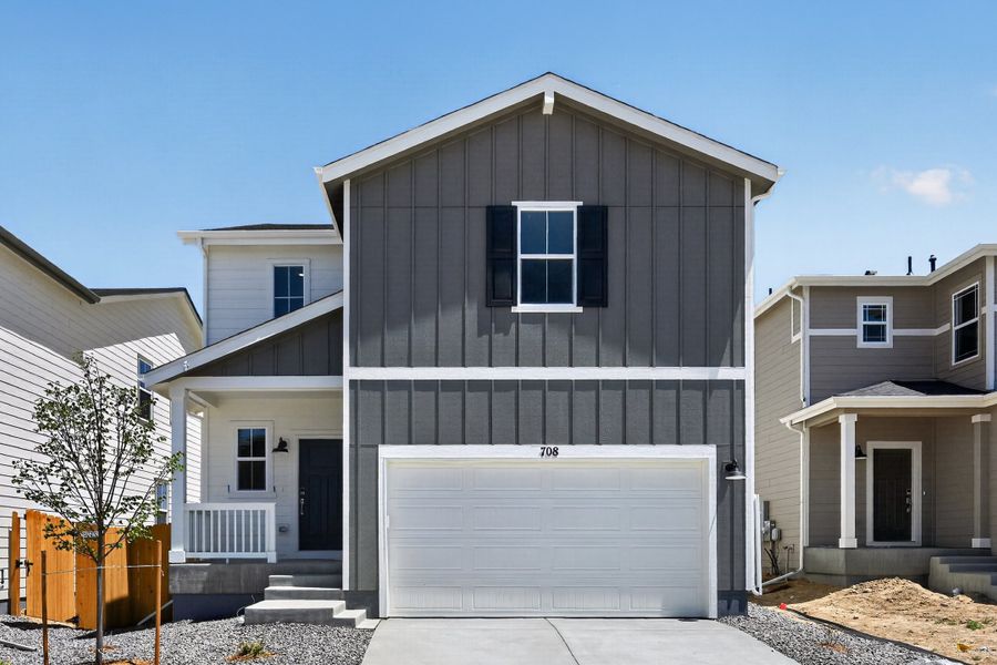 Front exterior of a new home in Lake Bluff, Greeley, CO, highlighting curb appeal (Image 1). Front exterior of a new home in Lake Bluff, Greeley, CO, highlighting curb appeal (Image 1).