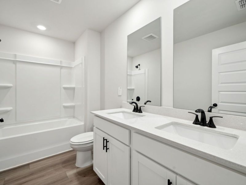 Furnished interior view inside a new home in Martin Springs - Estate Series, Lawrenceville (Image 9).
