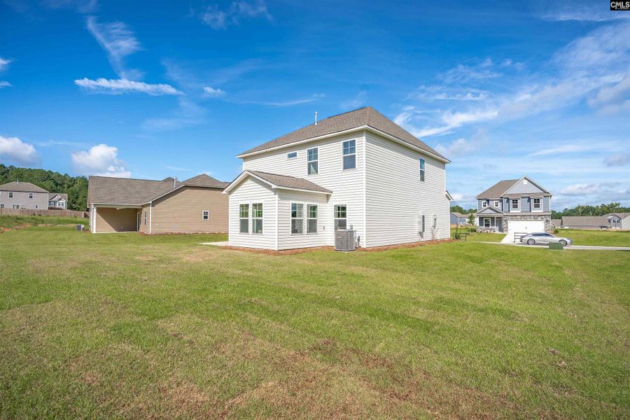 Front exterior of a new home in Rolling Hills, Prosperity, SC, highlighting curb appeal (Image 23).