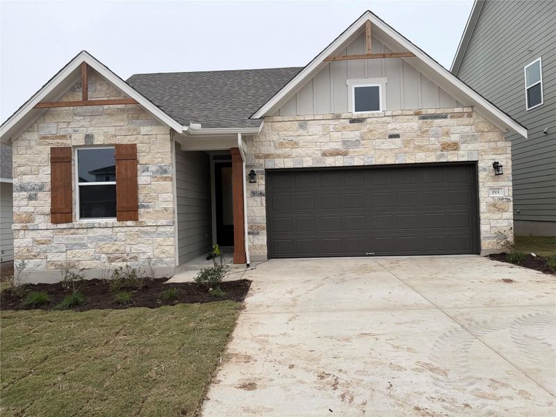 Front exterior of a new home in Cannon Ranch 45s, Dripping Springs, TX, highlighting curb appeal (Image 1). Front exterior of a new home in Cannon Ranch 45s, Dripping Springs, TX, highlighting curb appeal (Image 1).