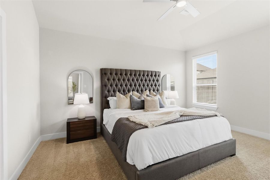 Your private primary bedroom offers generous proportions, plush carpeting, abundant natural light, and a relaxing retreat at the end of the day.