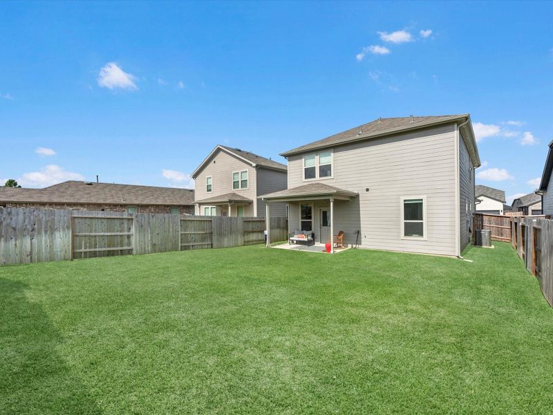 Exterior details and patio area of a home in Mavera, Conroe (Image 4).