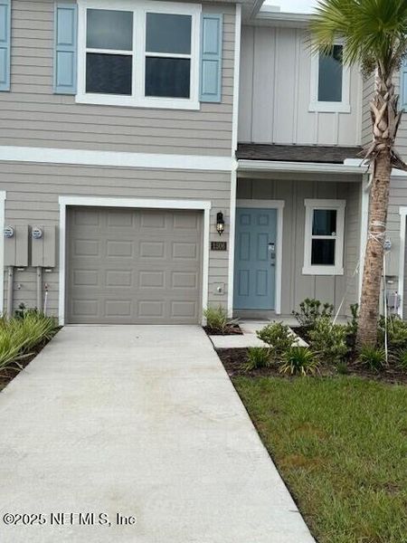 Exterior details and patio area of a home in The Landing, Middleburg (Image 2).
