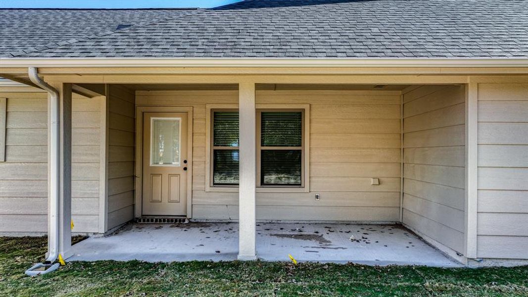 Exterior details and patio area of a home in , Poolville (Image 4).