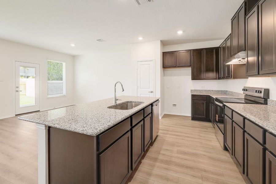 Furnished interior view inside a new home in Mustang Valley, Manor (Image 5).