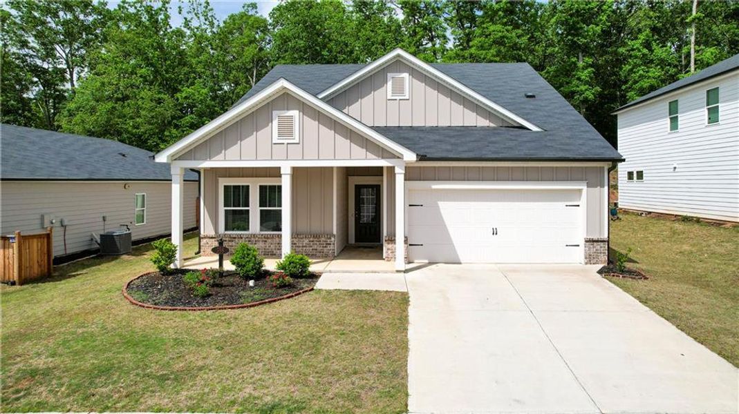Front exterior of a new home in , Canton, GA, highlighting curb appeal (Image 25).