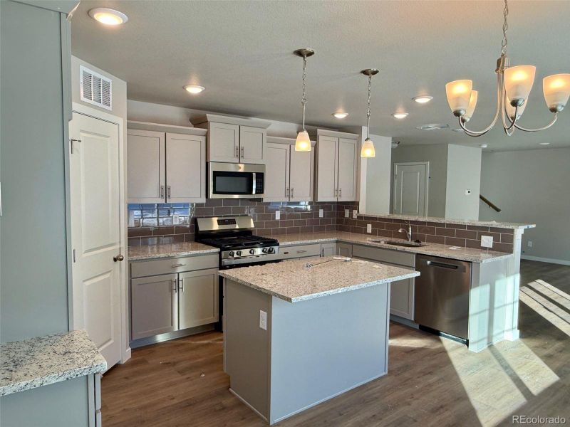 Furnished interior view inside a new home in , Watkins (Image 5). Furnished interior view inside a new home in , Watkins (Image 5).
