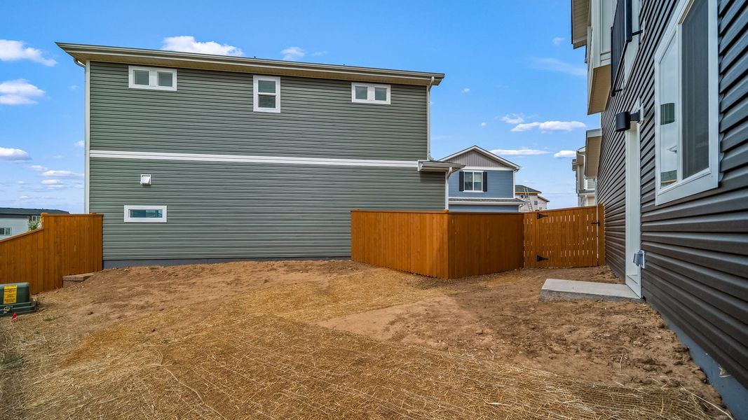Exterior details and patio area of a home in Reunion, Commerce City (Image 16).