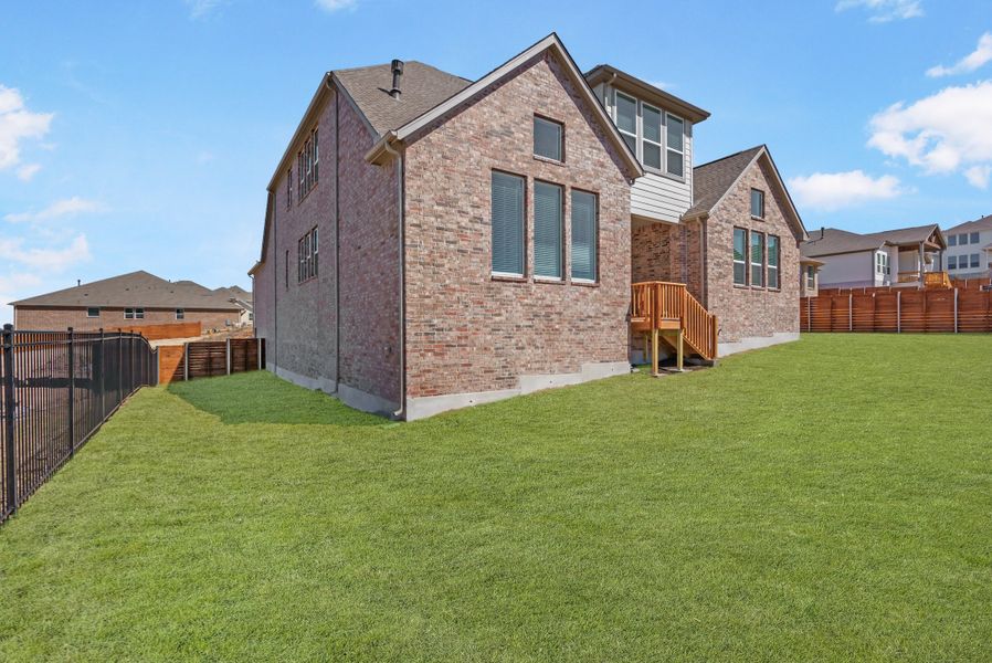 Representative exterior photo of a completed home built from the Hasley by Ashton Woods in The Estates at La Cima, San Marcos, TX (Image 18).