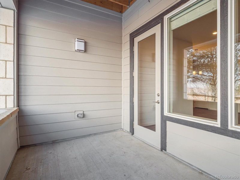 Exterior details and patio area of a home in Condo Collection at Grand Vue at Interlocken, Broomfield (Image 3).