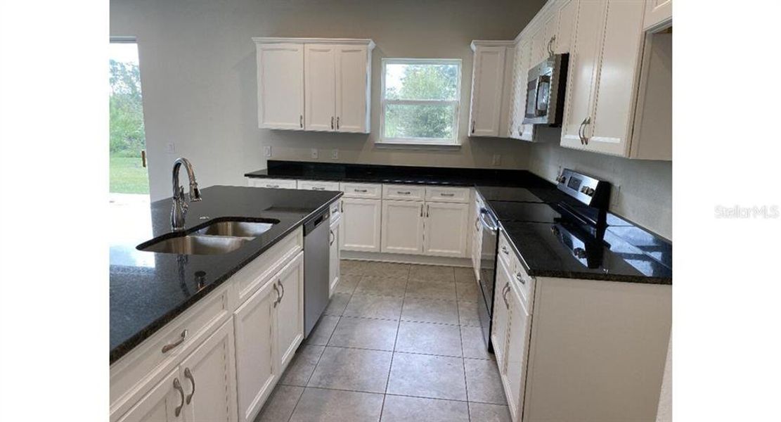 Furnished interior view inside a new home in , North Port (Image 3).