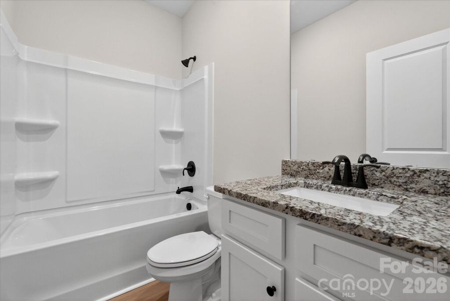 Furnished interior view inside a new home in Stagecoach Station, Gastonia (Image 8).