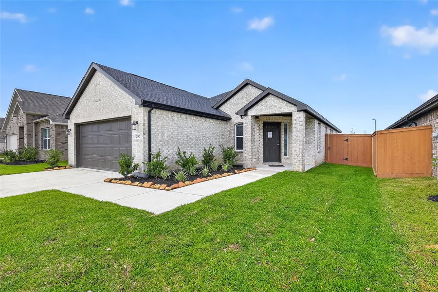 Front exterior of a new home in Cypress Green, Hockley, TX, highlighting curb appeal (Image 24).