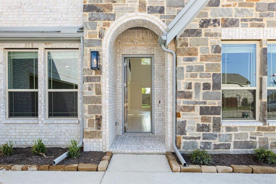 Front exterior of a new home in Ridgepoint, Midlothian, TX, highlighting curb appeal (Image 26). Front exterior of a new home in Ridgepoint, Midlothian, TX, highlighting curb appeal (Image 26).