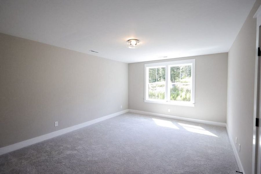 Spacious, unfurnished interior of a new home in Baker Road, Birchwood (Image 77).