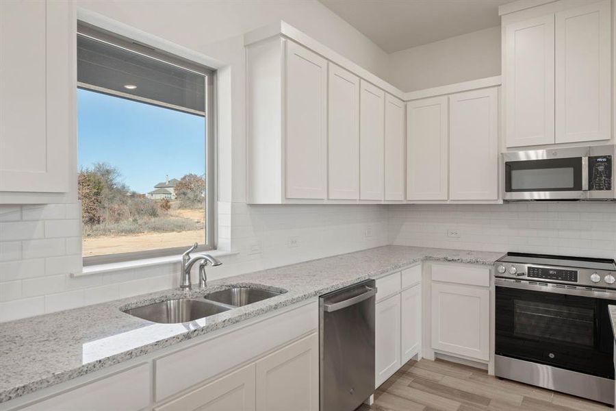 Furnished interior view inside a new home in Saddleback Estates, Boyd (Image 11).