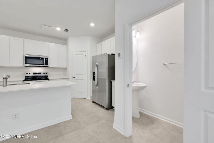 Furnished interior view inside a new home in Atlantis Pointe, Middleburg (Image 4).