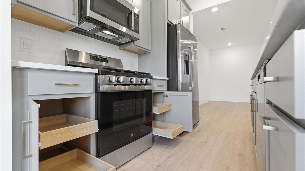 Accomplished kitchen design featuring sleek cabinetry and abundant storage located at the Silo Ridge community