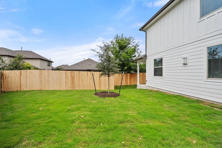 Front exterior of a new home in The Hills of Bear Creek, Manchaca, TX, highlighting curb appeal (Image 6).