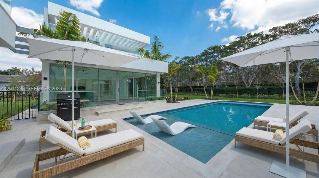 Exterior details and patio area of a home in , Weston (Image 25).
