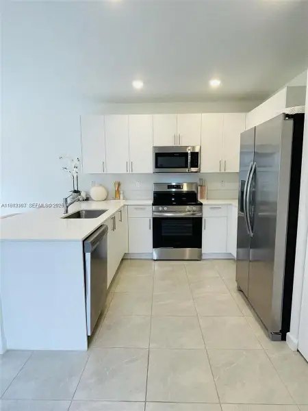 Furnished interior view inside a new home in , Pembroke Park (Image 13).