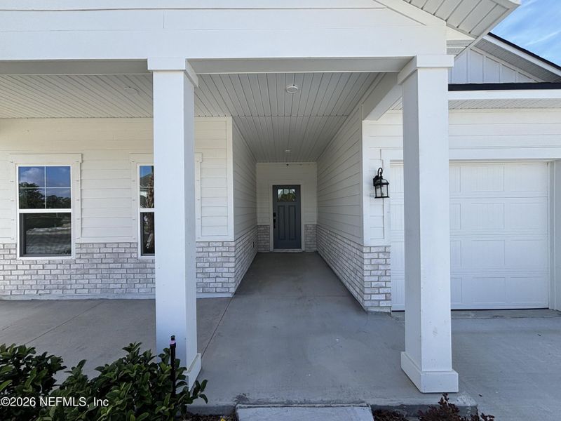 Exterior details and patio area of a home in The Cypress Series at Reserve East, Flagler Beach (Image 17).