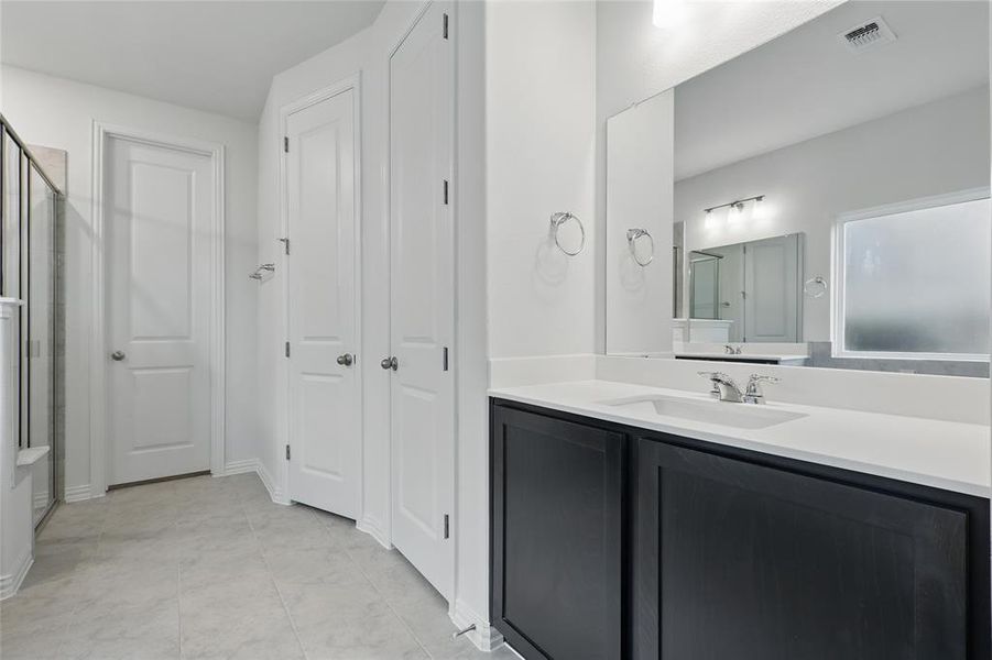 Full bathroom with an enclosed shower and vanity Full bathroom with an enclosed shower and vanity