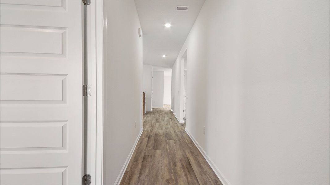 Representative unfurnished interior of a home built from the Aspen by D.R. Horton in Owl's Head East, Freeport (Image 18).