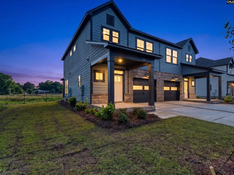 Front exterior of a new home in Dunbar Village, Cayce, SC, highlighting curb appeal (Image 21). Front exterior of a new home in Dunbar Village, Cayce, SC, highlighting curb appeal (Image 21).